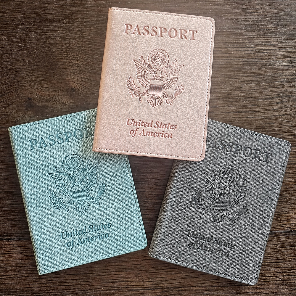 Three Stylish Passport Covers in Pink, Blue, and Gray